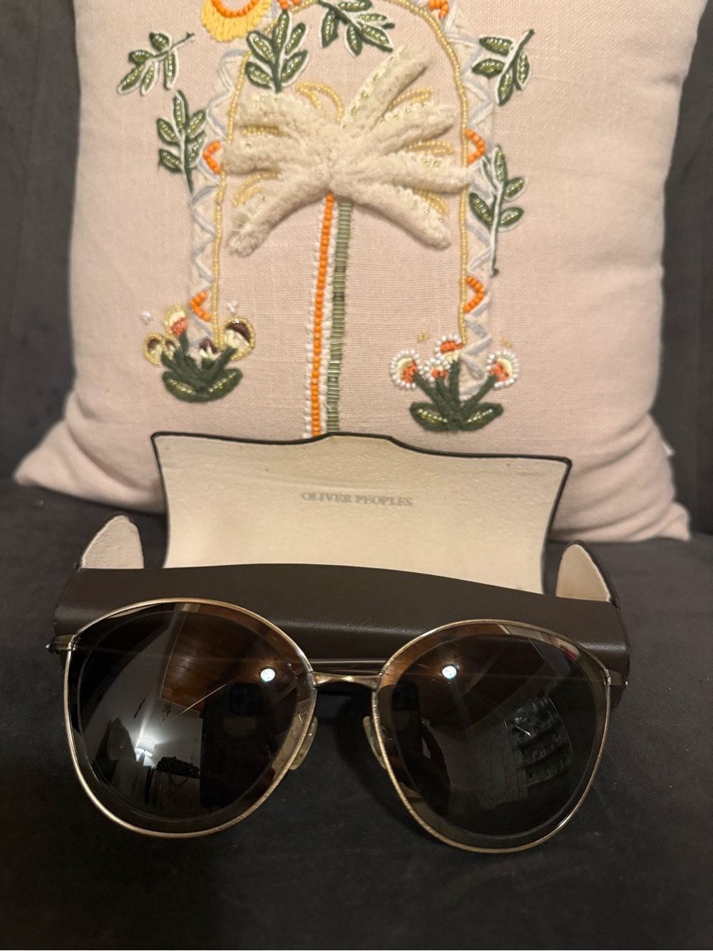 Oliver Peoples Gunmetal Frame Sunglasses with Dark Lenses